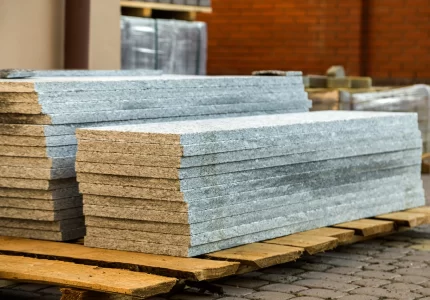 Piles of granite marble slabs. Stone sheets for decorative construction
