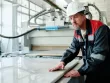 worker cutting marble in factory