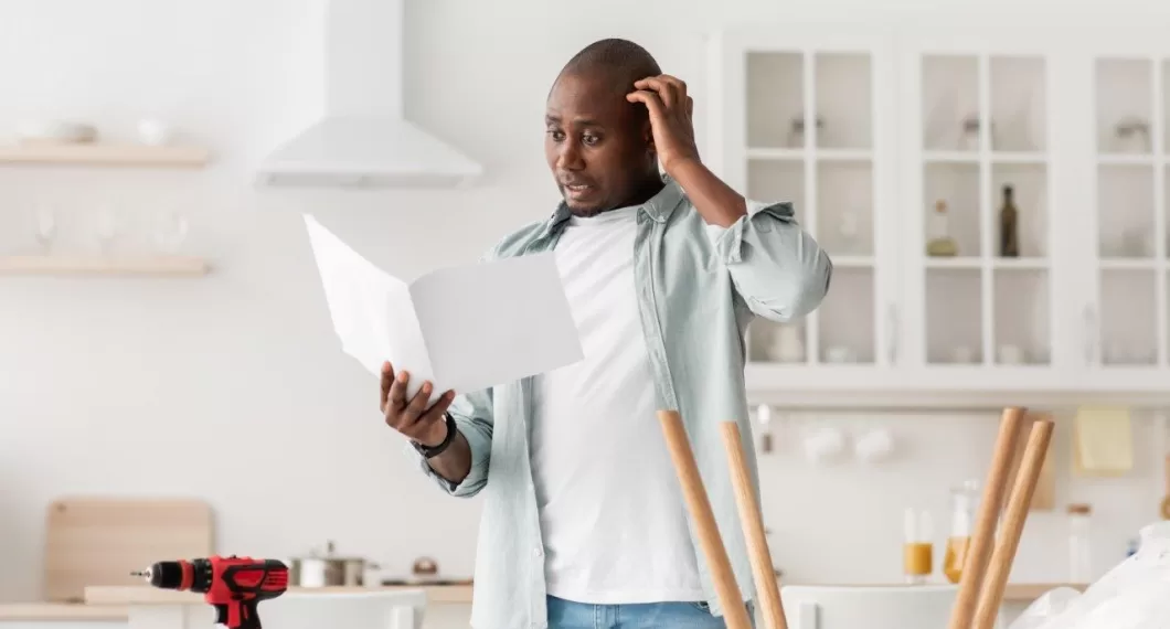 confused man having hard time estimate kitchen countertop investment