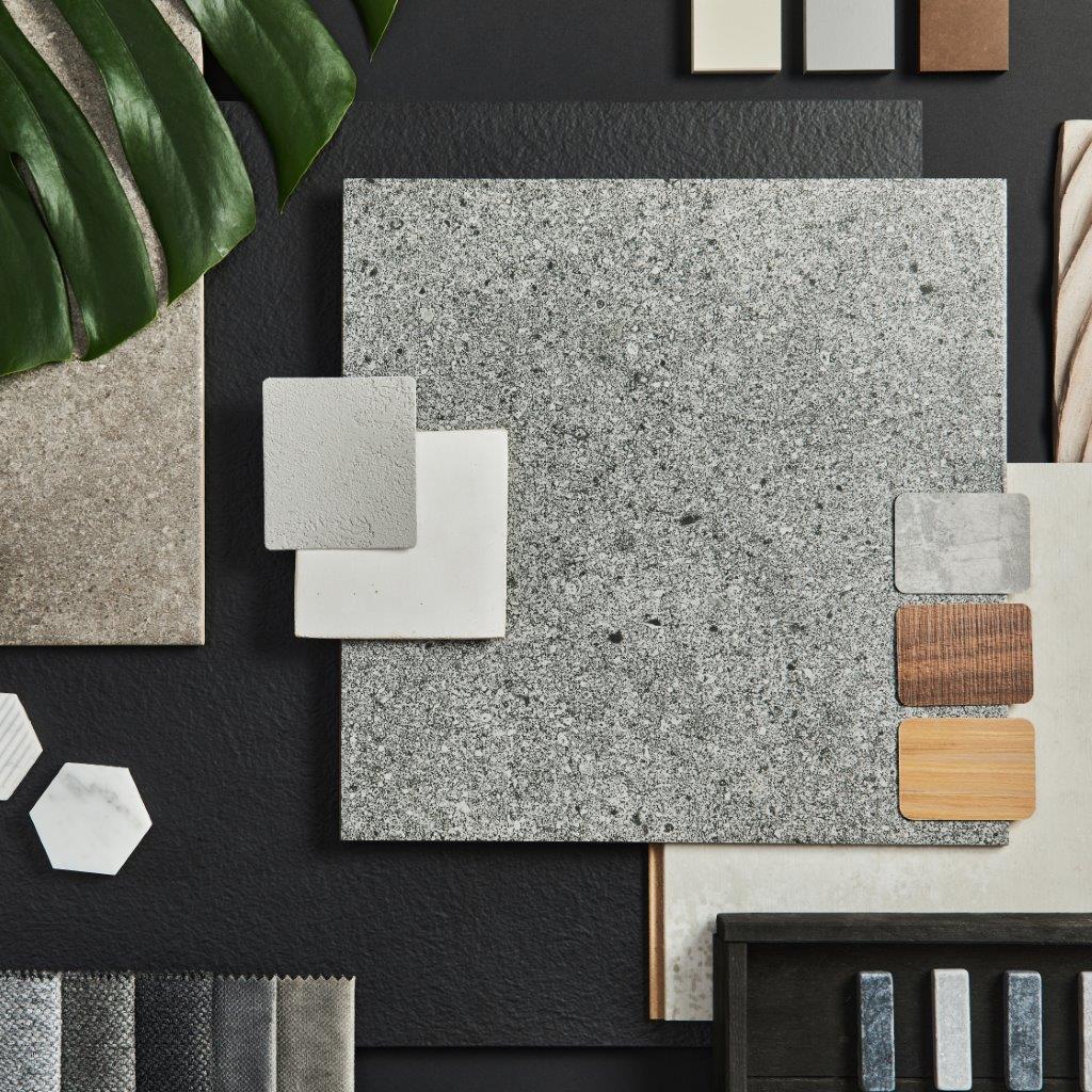 Flat lay granite countertop composition of creative black architect moodboard